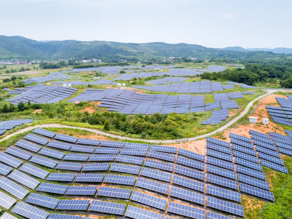 solar-power-station-on-hillside-aerial-view-of-renewable-energy.jpg